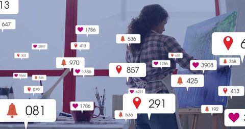 Artist creating masterpiece in modern art studio with social media engagement icons