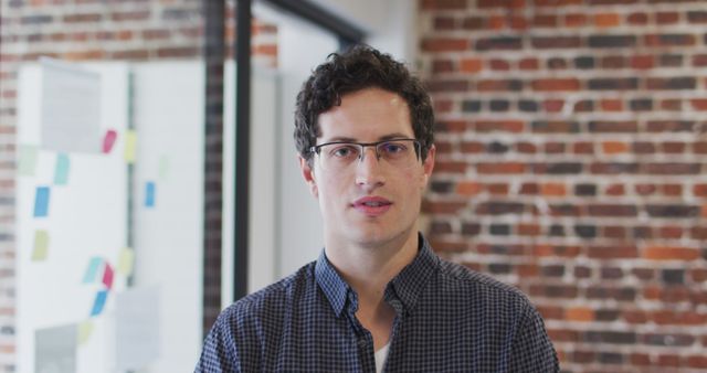 Young Professional Wearing Glasses in Modern Office - Download Free Stock Images Pikwizard.com