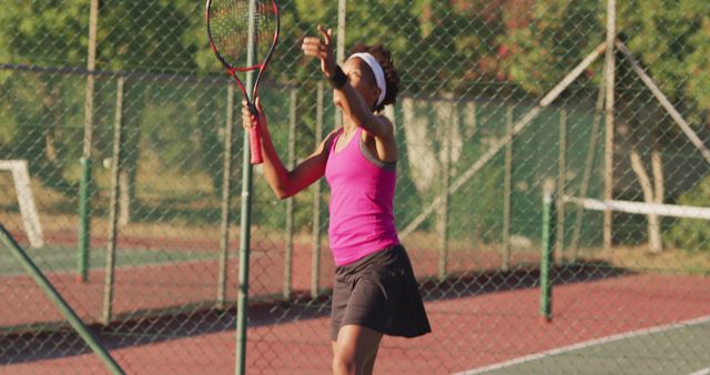 Woman Serving Tennis Ball on Outdoor Court During Daytime - Download Free Stock Images Pikwizard.com