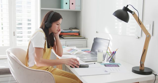 Young Woman Working from Home at Modern Desk with Laptop - Download Free Stock Images Pikwizard.com