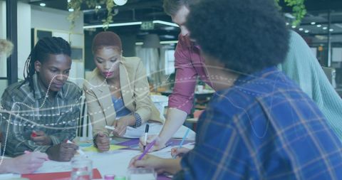 Diverse Team Collaborating During Creative Meeting at Office