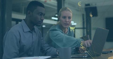 Diverse colleagues teaming up in modern workspace with online business icons