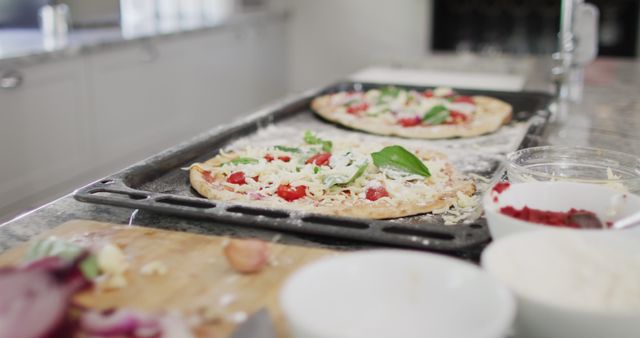 Homemade Pizzas Being Prepared on Kitchen Countertop - Download Free Stock Images Pikwizard.com