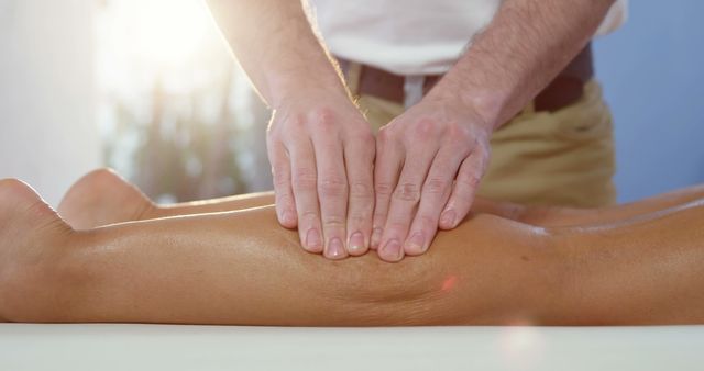A massage therapist relieves a client's tension, epitomizing therapeutic relaxation. - Download Free Stock Photos Pikwizard.com