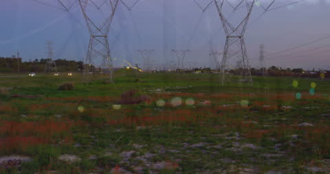 Financial Graphs Overlay on Electric Towers in Countryside