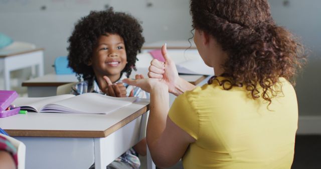 Image of happy caucasian female teacher learning math to african american boy - Download Free Stock Photos Pikwizard.com