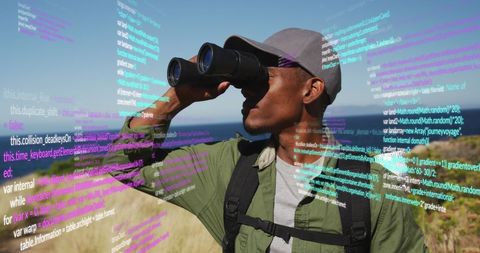 Man with binoculars observing data overlay outdoors