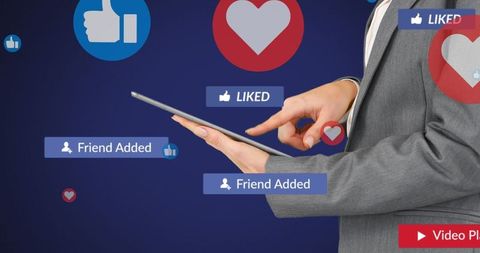 Businessman Using Tablet with Social Media Icons and Notifications