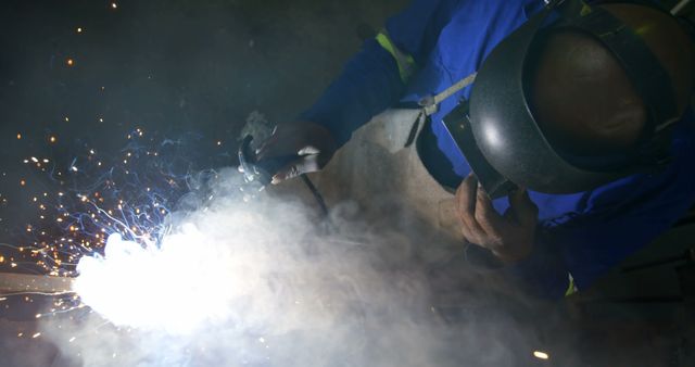 Welder Working with High-Powered Welding Torch Evoking Sparks and Smoke - Download Free Stock Images Pikwizard.com