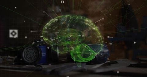 Holographic green brain projection hovering above workshop workbench showing neural network