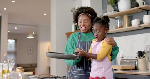 Mother and Daughter Enjoy Cooking Together in Modern Kitchen - Download Free Stock Images Pikwizard.com