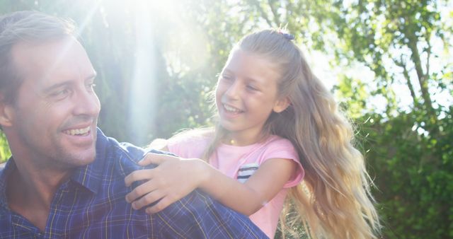 Father and daughter bonding outdoors in sunlight - Download Free Stock Images Pikwizard.com