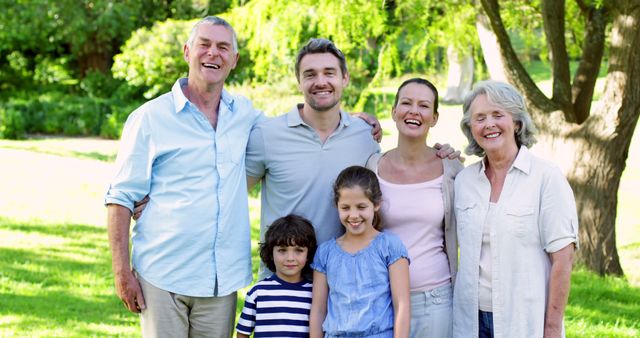 Happy multi-generational family enjoying outdoor picnic - Download Free Stock Images Pikwizard.com