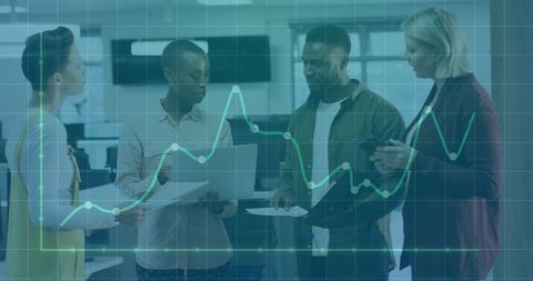 Team Analyzing Performance Data with Graph Overlay in Office