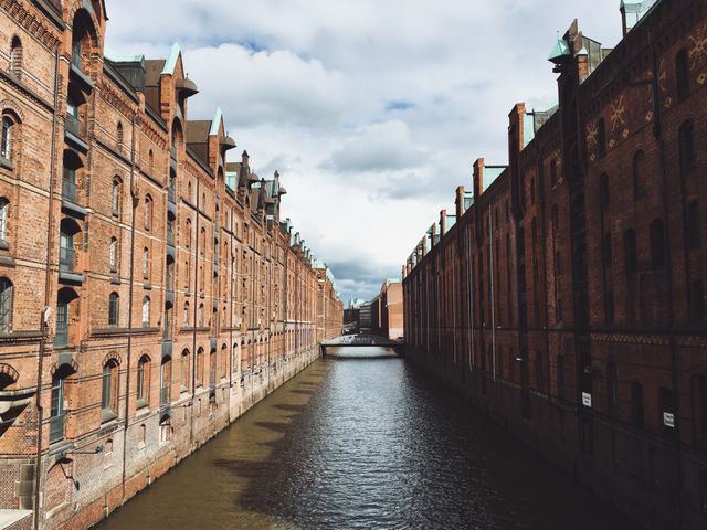 Historic Brick Warehouses by Canal in Hamburg, Germany - Download Free Stock Images Pikwizard.com