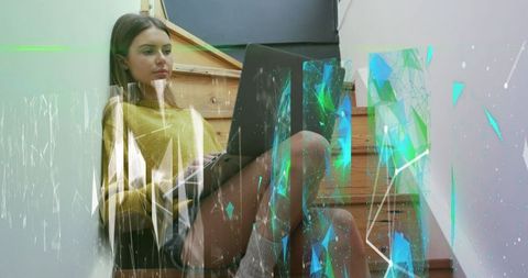 Woman Using Laptop with Futuristic Digital Interface Overlay