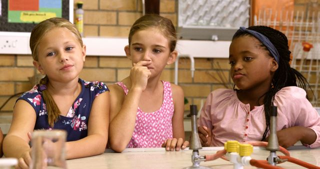 Multi-Ethnic Group of Girls Listening Attentively in Science Class - Download Free Stock Images Pikwizard.com