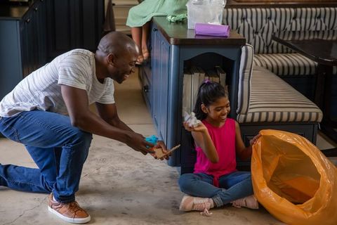 Father and Daughter Enjoying Recycling at Home