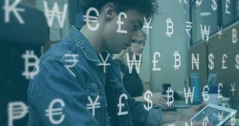 Office Professional Analyzing Financial Data on Tablet with Currency Symbols