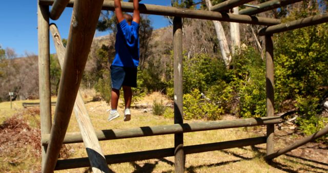 A boy relishes climbing a jungle gym, underscoring play's role in child growth. - Download Free Stock Photos Pikwizard.com