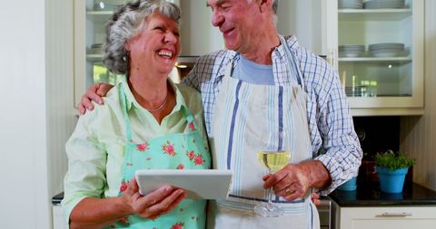 Senior Couple Sharing Laughter in Kitchen - Download Free Stock Images Pikwizard.com