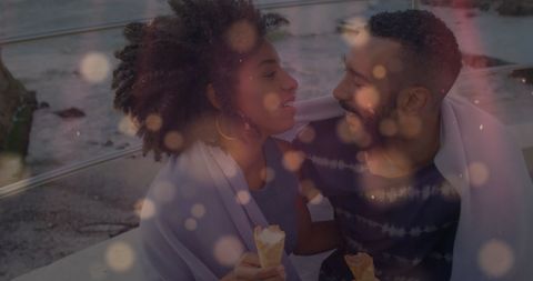 Romantic Couple Enjoying Ice Cream and Embrace at Beach