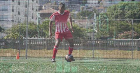Footballer Training with Futuristic Digital Interface Display