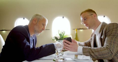 Businessmen Collaborating Inside Luxury Private Jet - Download Free Stock Images Pikwizard.com
