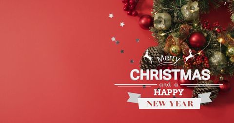 Festive Christmas Card with Decorated Wreath on Red Background