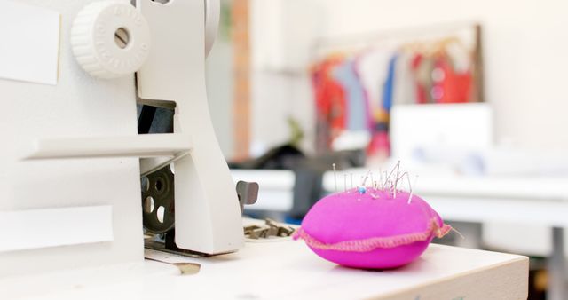 Close-up of sewing equipment with fabric background in studio - Download Free Stock Images Pikwizard.com