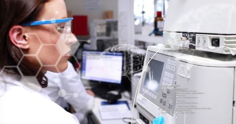 Female Scientist Analyzing Data with Advanced Lab Equipment - Download Free Stock Images Pikwizard.com