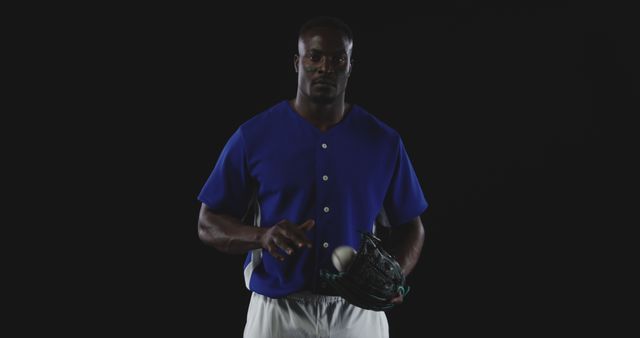 Athletic Man Holding Baseball Glove Isolated on Dark Background - Download Free Stock Images Pikwizard.com