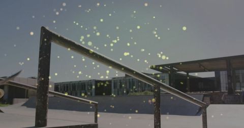 Sunlit Skatepark Rail with Splattering Bokeh in Urban Setting