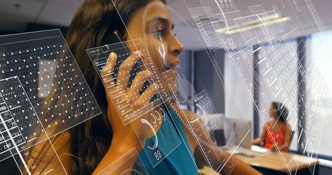Professional woman talking on smartphone with holographic ar interface in open office
