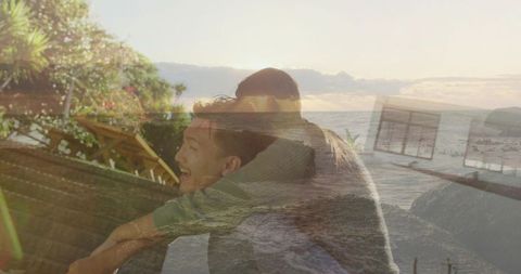 Sunset beach romance double exposure couple laughing piggyback on coastal deck
