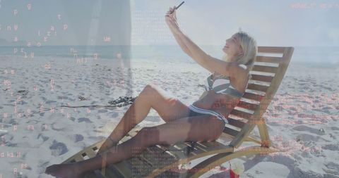 Woman on Beach Multitasking with Technology