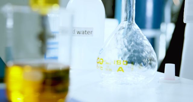 Various Glassware and Liquid in Laboratory Environment - Download Free Stock Images Pikwizard.com