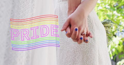 Female Couple Holding Hands Celebrating Pride