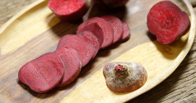 Freshly Cut Beetroot Slices and Whole Beetroot on Wooden Plate - Download Free Stock Images Pikwizard.com