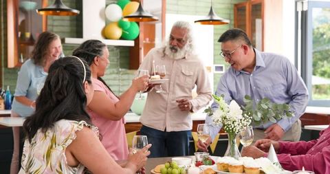 Diverse Seniors Celebrating Birthday with Toast