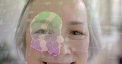 Senior asian woman smiling with hexagon head overlay representing ai and digital health