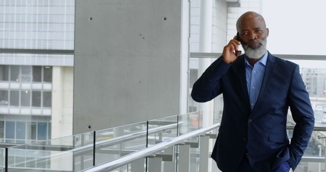 Confident Businessman Having Phone Call in Modern Office Building - Download Free Stock Images Pikwizard.com