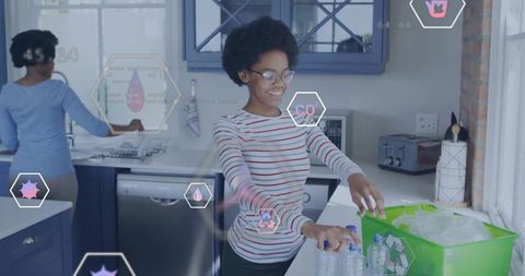 Teen sorting plastic bottles for recycling in smart kitchen with ar icons