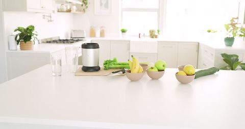 Minimalist Kitchen Island with Blender and Fresh Produce