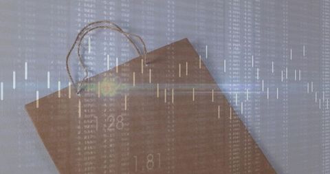 Kraft paper bag with candlestick chart overlay in studio