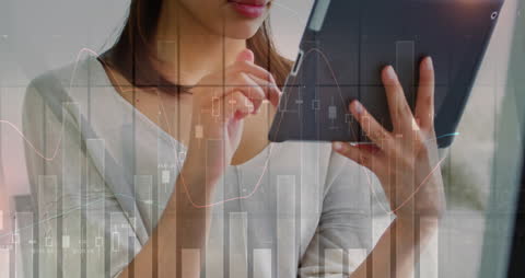 Woman Using Tablet with Digital Data Overlay