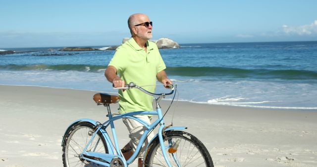 Senior man walking with a vintage bicycle alongside the beach, enjoying the fresh ocean breeze. Ideal for depicting healthy lifestyle, leisure activities, retirement, and travel. Great for use in advertisements, health and wellness articles, or travel brochures.