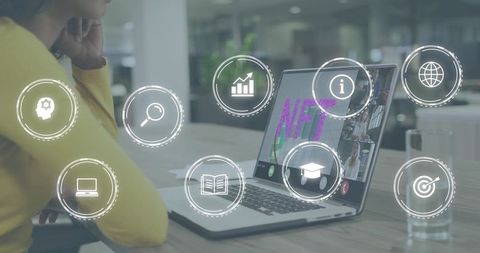 Professional Viewing NFT Dashboard on Laptop with Futuristic HUD Icons for Remote Teams