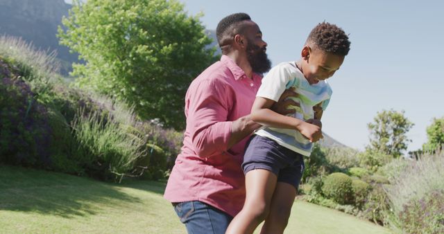 Father Playing with Son Outdoors on a Sunny Day - Download Free Stock Images Pikwizard.com