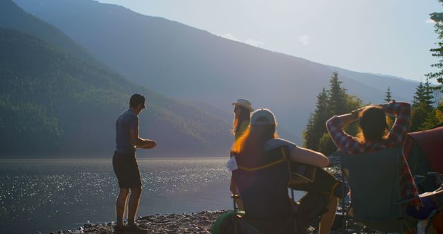 Group of Friends Enjoying Lakeside Camping at Sunset - Download Free Stock Images Pikwizard.com